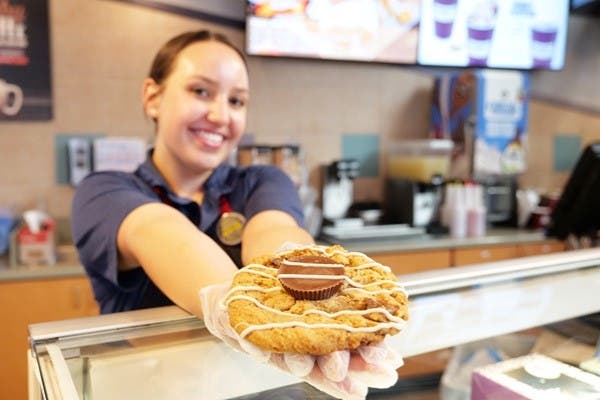 Employee serving cookie