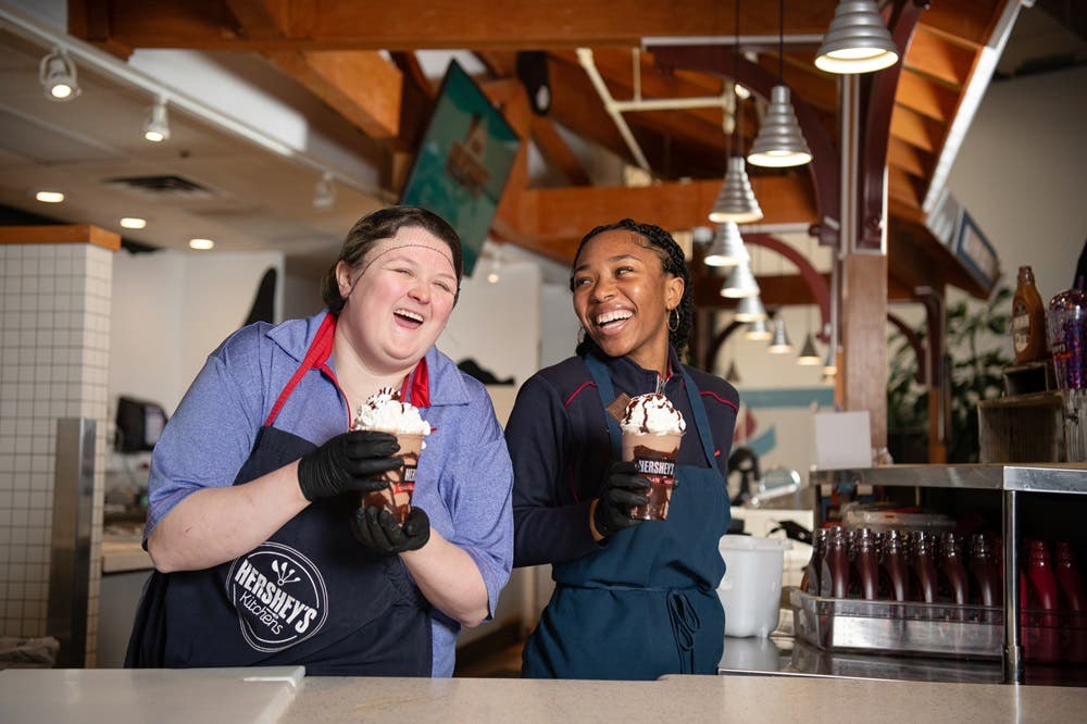 Employees enjoying milkshakes