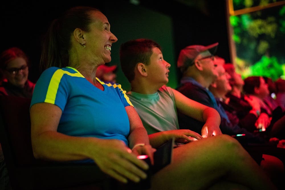 Mom and son engaging with theatre